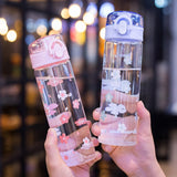 Gourde en verre motif fleur avec paille